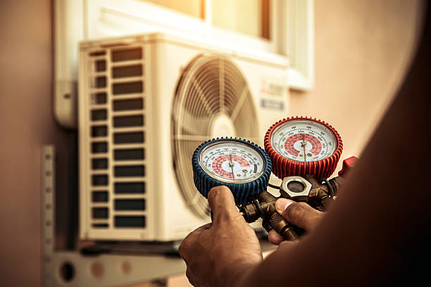 Professional Heat Pump Repair technician working in Fall River, MA